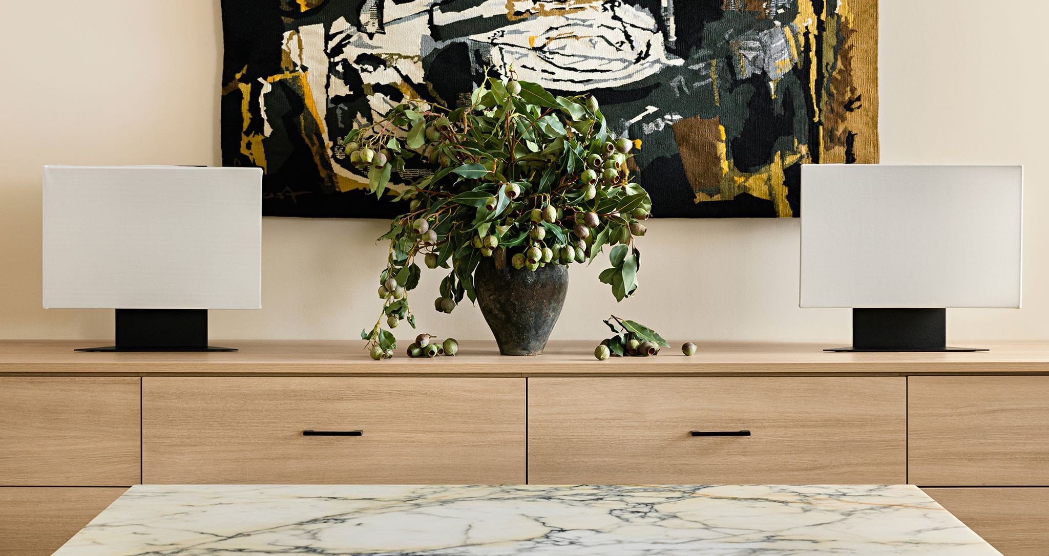 Custom office drawers in a light wood grain finish by California Closets