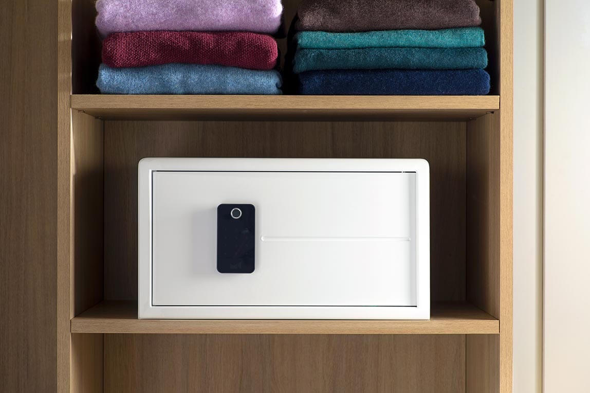 Safe for a walk-in closet shown on open shelf from California Closets