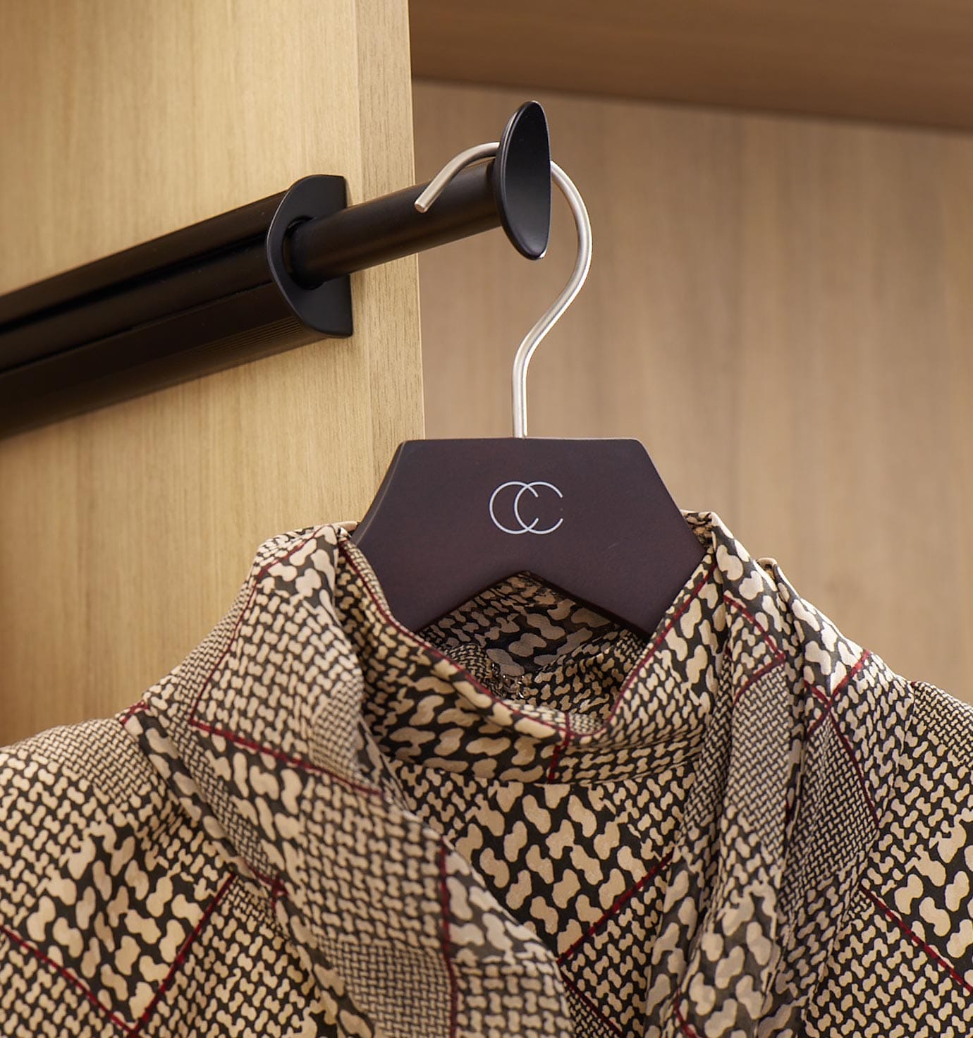 Personalized closet accessories with valet rack for hanging clothes by California Closets