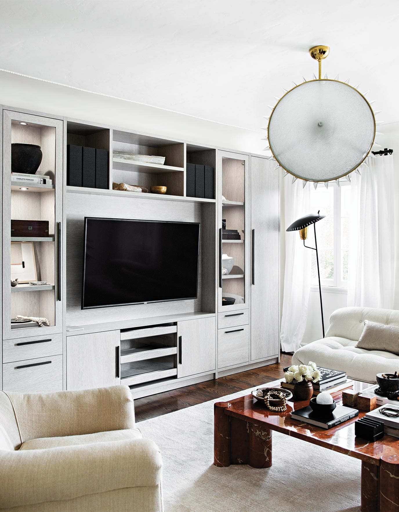 Jeremiah Brent's entertainment center designed by California Closets, which the team uses to video conference with its New York office.